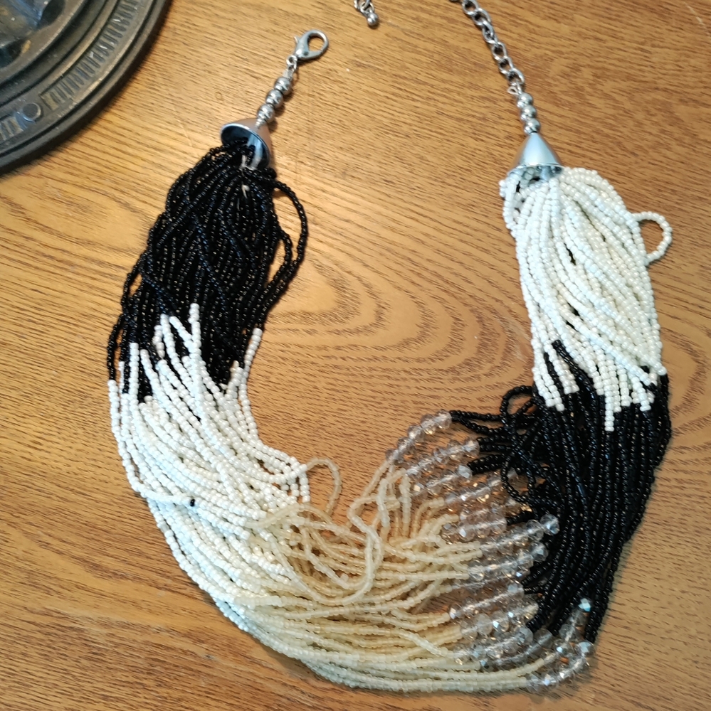 Beaded necklace. 35 strands. EUC Amazing look against neutral sweaters.